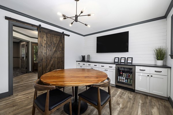 Elegant clubhouse with contemporary decor at North Forest Apartments, ideal for hosting gatherings and social events