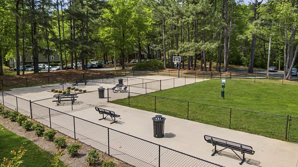 Dog park with agility equipment at North Forest Apartments, a Greystar luxury community