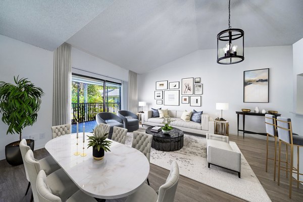 Spacious living room with modern decor and large windows at Cielo Point Apartments