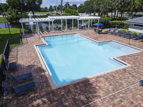 Infinity-edge pool with resort-style lounge area at Cielo Point Apartments