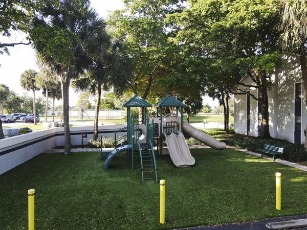 Playground with modern equipment at Cielo Point Apartments offers family-friendly activity space