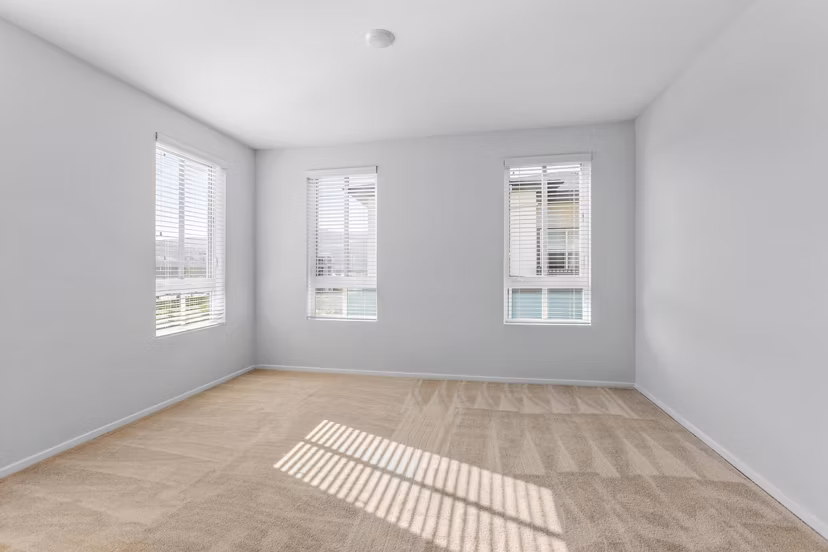 Modern bedroom with cozy furnishings at The Element Apartments