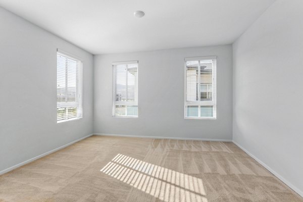 Modern bedroom with cozy furnishings at The Element Apartments