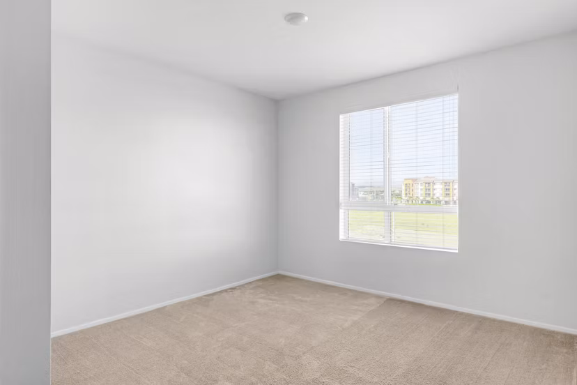 Modern bedroom with plush furnishings at The Element Apartments
