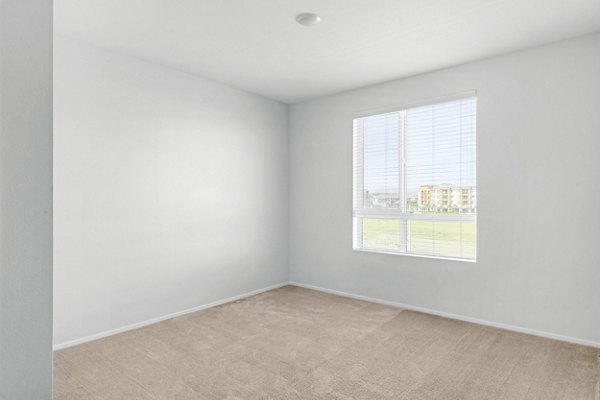 Modern bedroom with plush furnishings at The Element Apartments