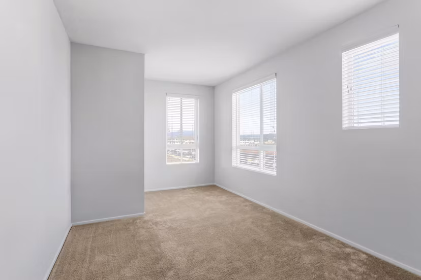 The Element Apartments: Cozy bedroom with modern decor and elegant bedding