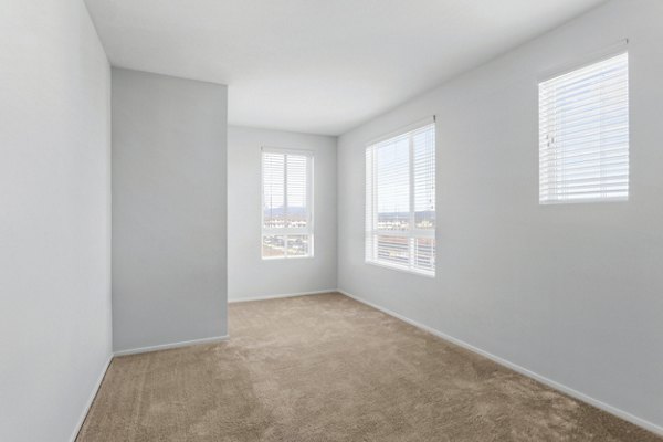 The Element Apartments: Cozy bedroom with modern decor and elegant bedding