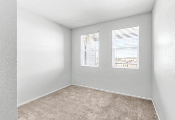 Cozy bedroom with modern decor at The Element Apartments, ideal for luxury living