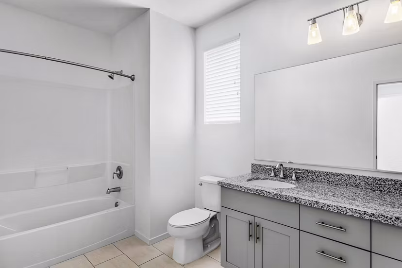 Modern bathroom with sleek fixtures at The Element Apartments
