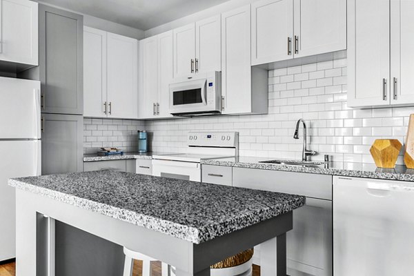 Modern kitchen featuring stainless steel appliances at The Element Apartments