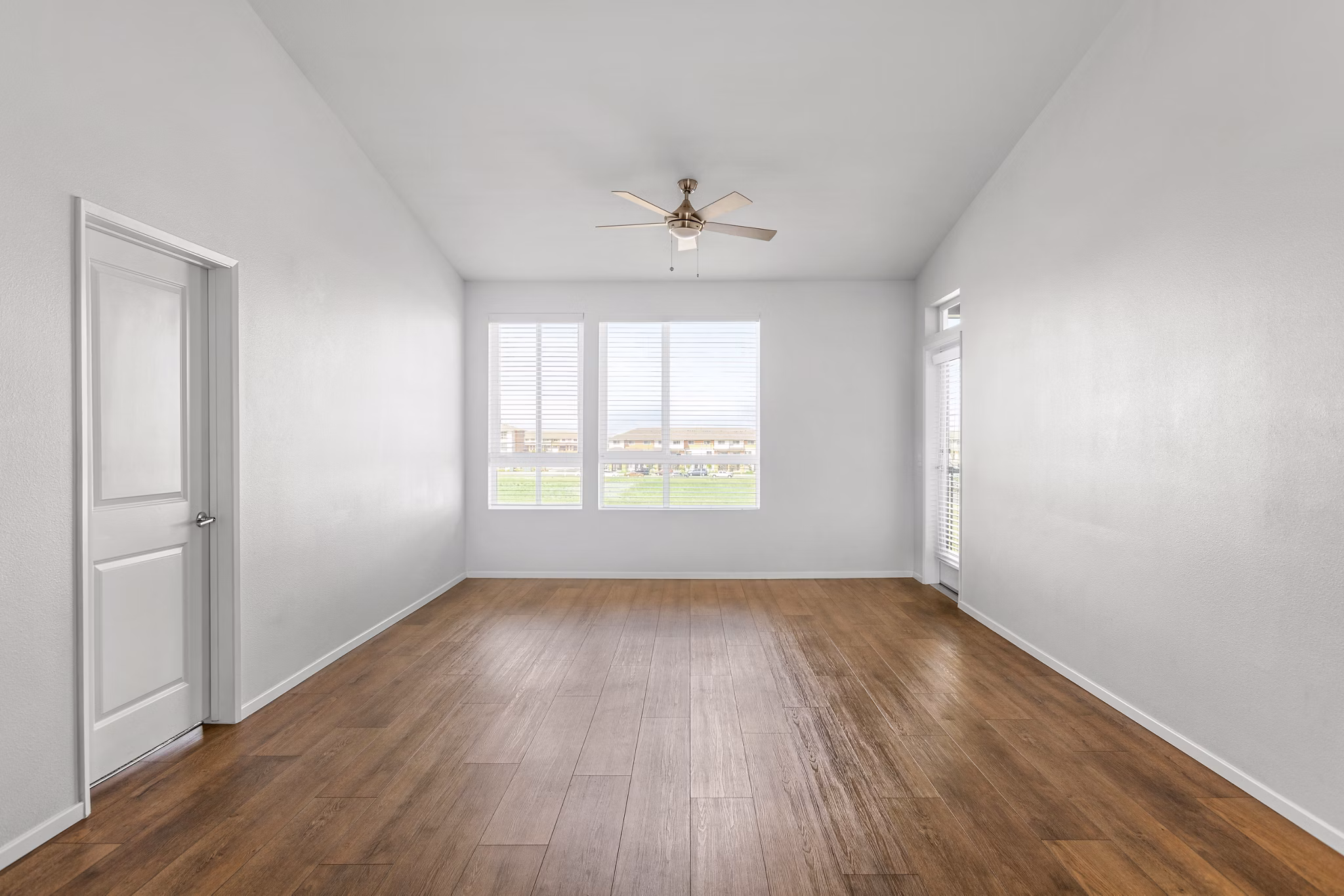 Cozy living room with modern decor and natural light at The Element Apartments