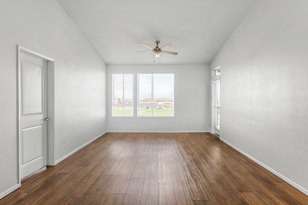 Cozy living room with modern decor and natural light at The Element Apartments