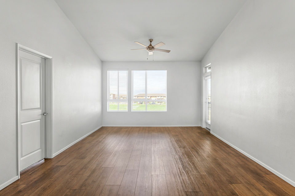 Cozy living room with modern decor and natural light at The Element Apartments
