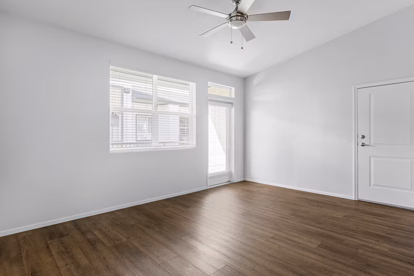 Living room with modern decor and natural light at The Element Apartments
