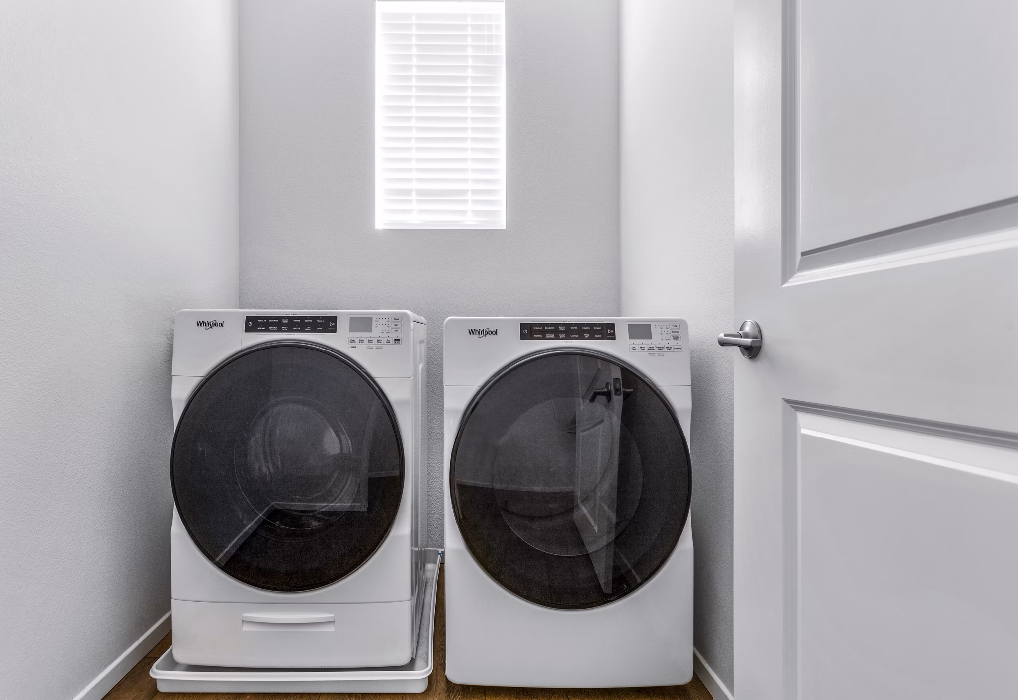 Laundry room equipped with modern washers and dryers at The Element Apartments, ideal for convenient and efficient laundry care
