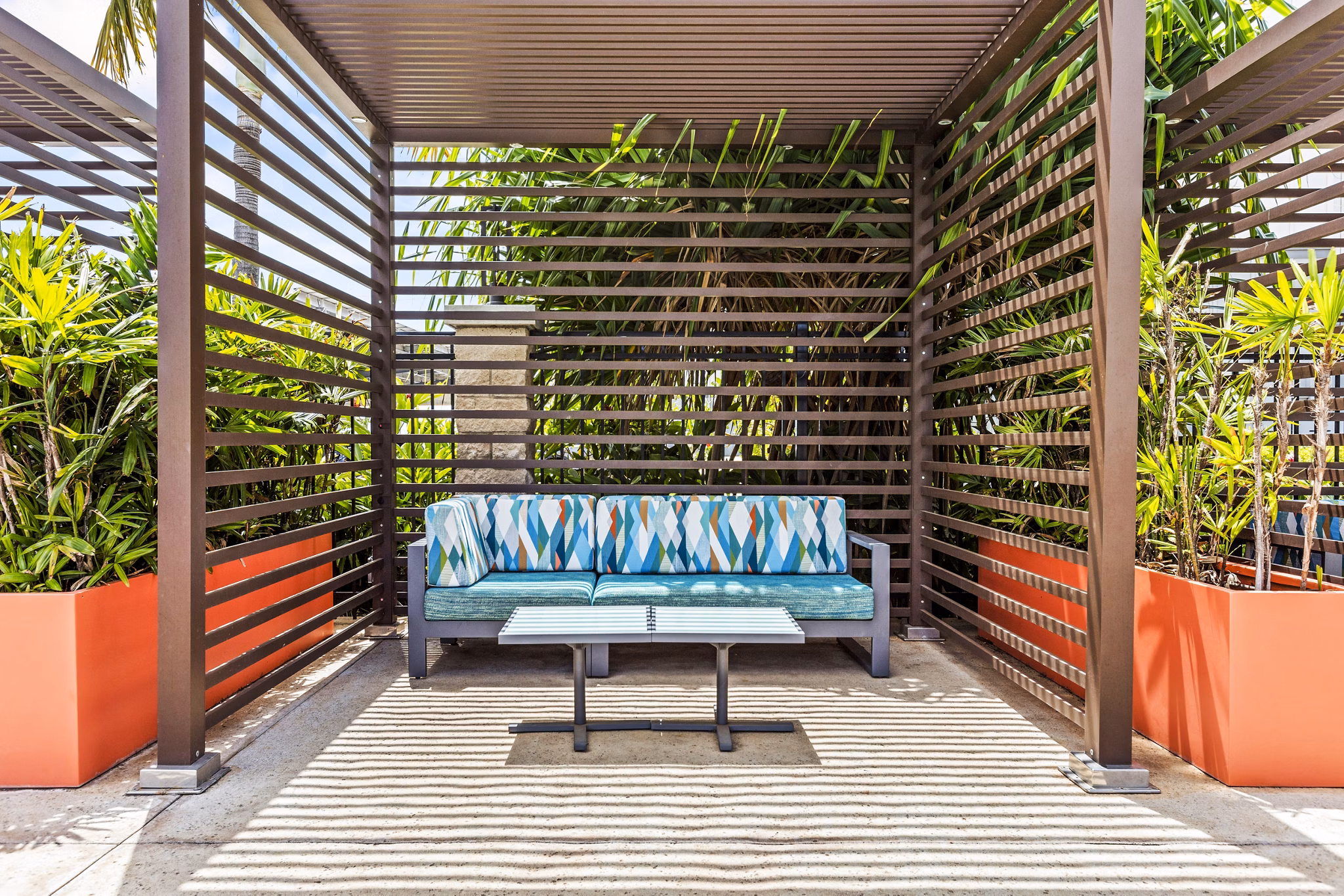 Patio at The Element Apartments: Outdoor living space with stylish seating and garden views