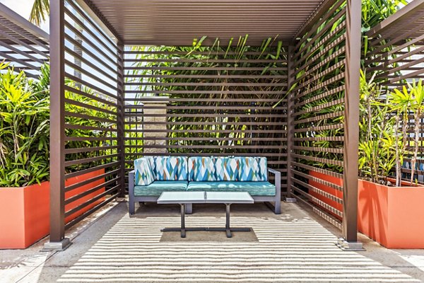 Patio at The Element Apartments: Outdoor living space with stylish seating and garden views