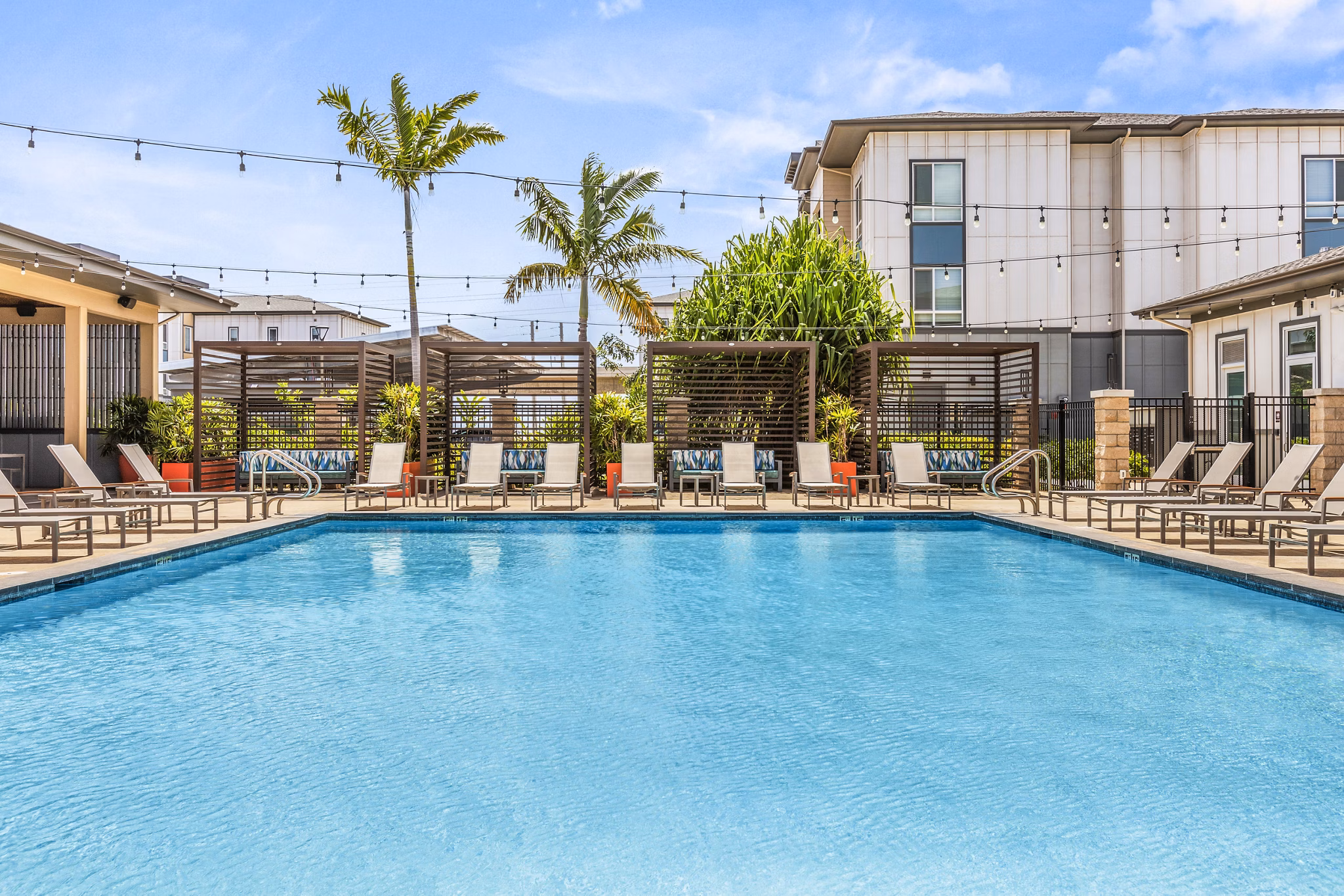 Rooftop pool with cityscape at The Element Apartments, luxury living in urban style