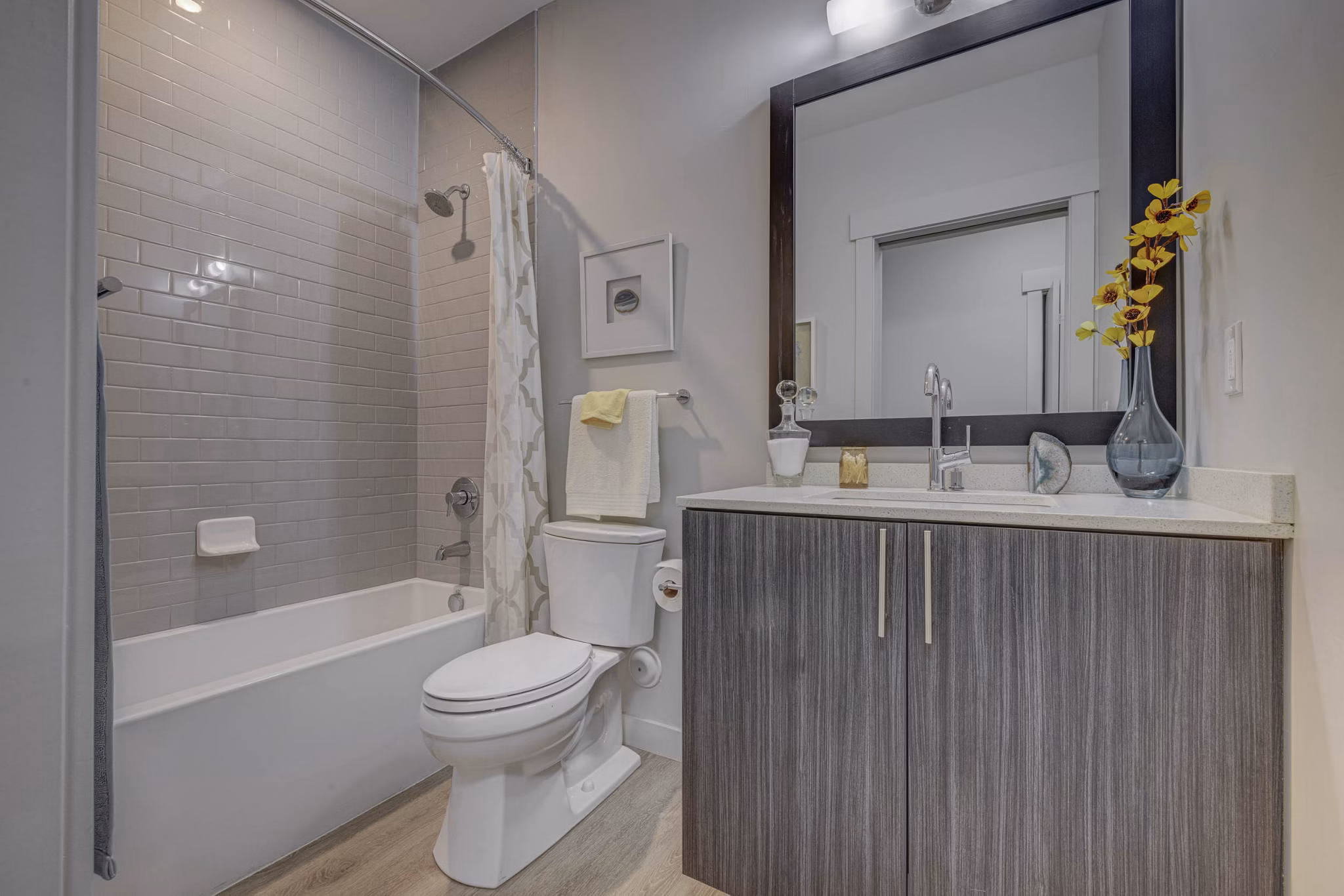 Bathroom featuring modern fixtures and sleek design at The Calo Apartments