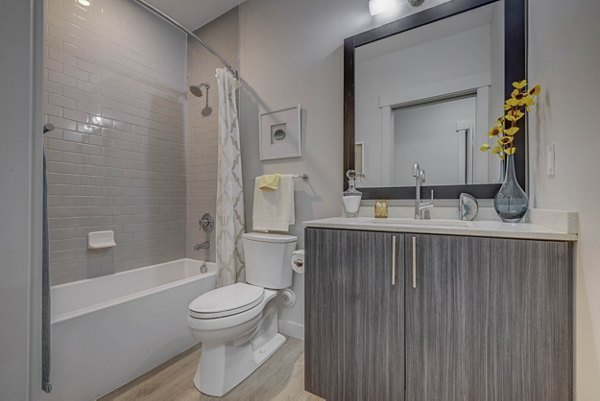 Bathroom featuring modern fixtures and sleek design at The Calo Apartments