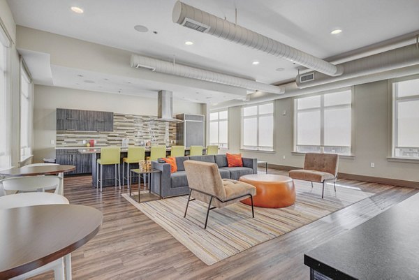 Clubhouse featuring modern design and seating areas at The Calo Apartments, luxury living in a vibrant community