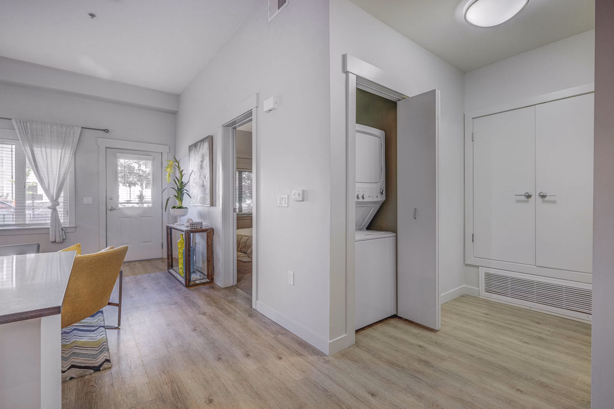 Modern kitchen with stainless steel appliances in The Calo Apartments