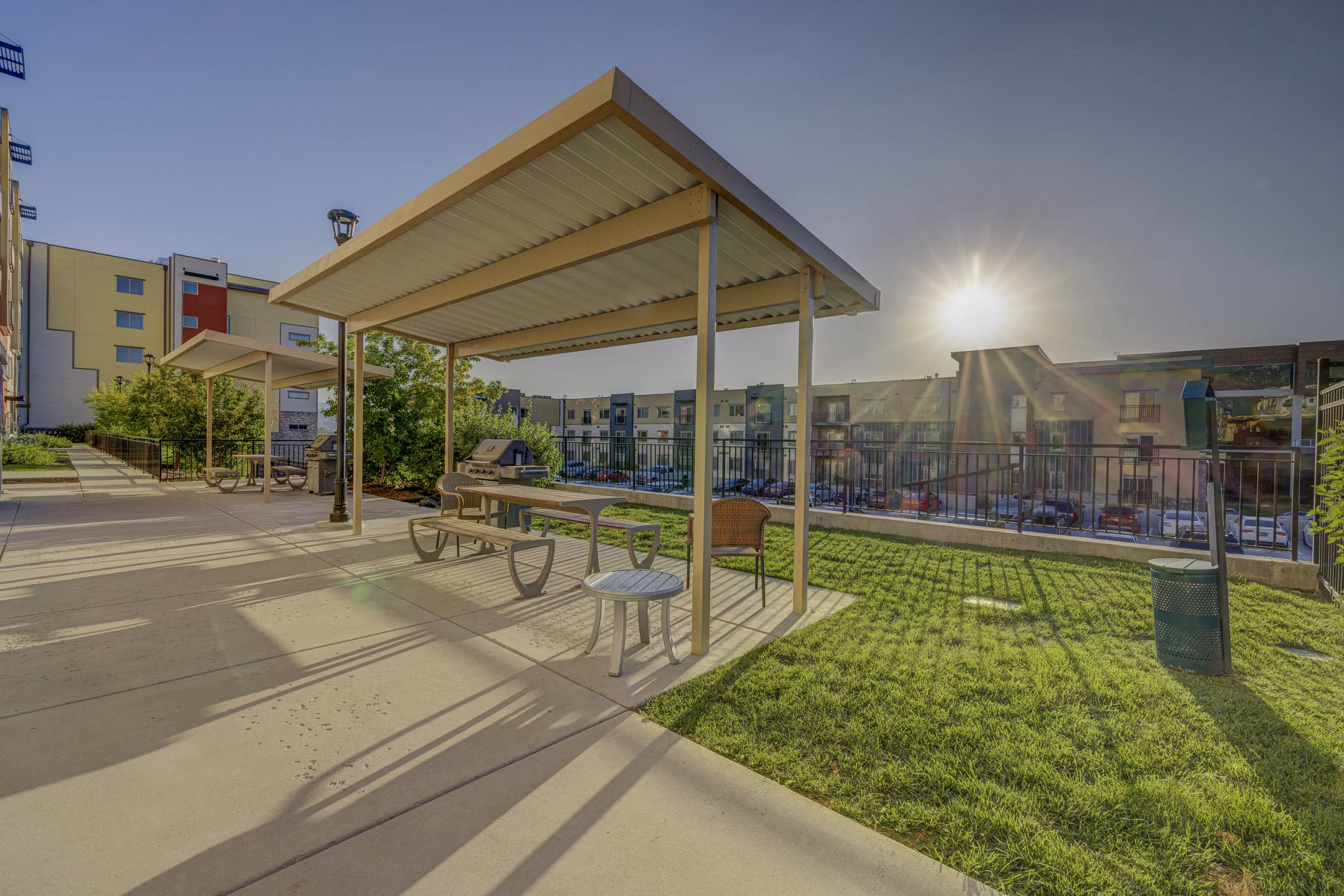 Courtyard with lush gardens and seating areas at The Calo Apartments, a luxury living community