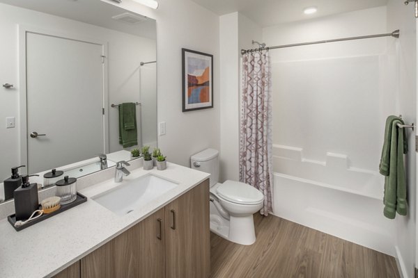 Spacious bathroom with modern fixtures at The Overland Apartments, offering luxury living in a prime location