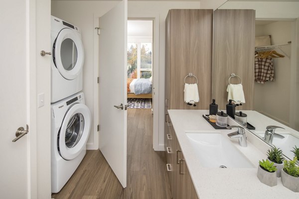 Laundry room with modern appliances at The Overland Apartments in luxury Greystar property