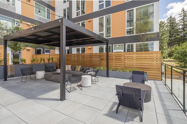 Courtyard with lush greenery and seating areas at The Overland Apartments, a luxury community by Greystar