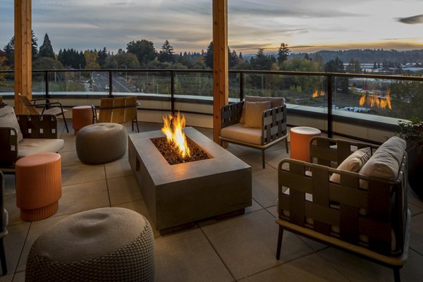 Fire pit patio area at The Overland Apartments offering cozy outdoor gatherings and relaxation spots