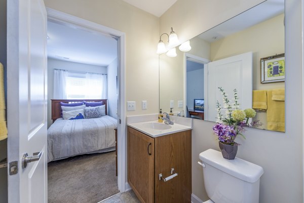 Modern bathroom with sleek fixtures at Campus View Apartments, luxury living option by Greystar