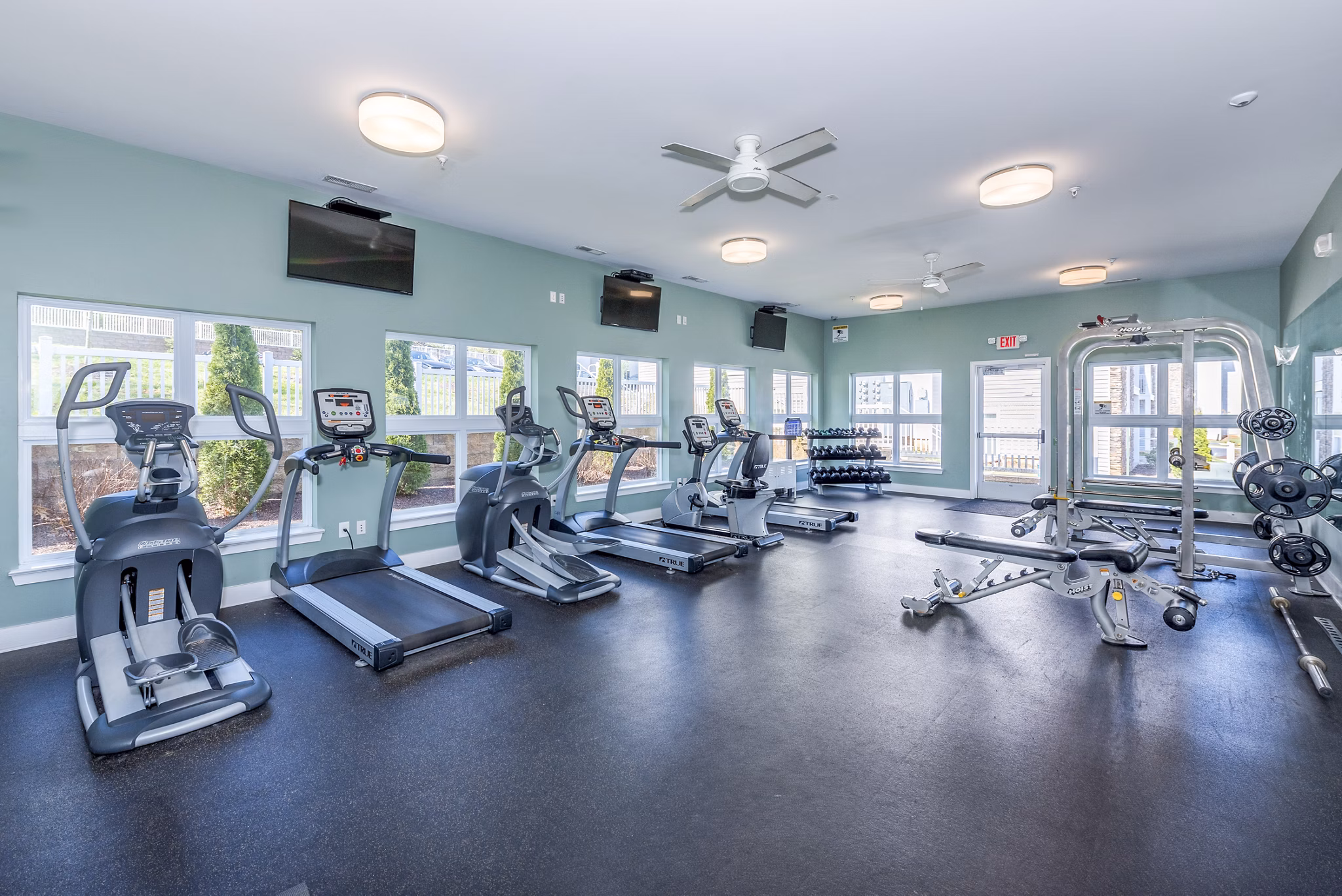 Modern fitness center with state-of-the-art equipment at Campus View Apartments, offering premium amenities for residents seeking luxury living