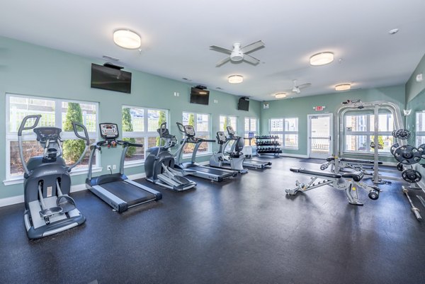 Modern fitness center with state-of-the-art equipment at Campus View Apartments, offering premium amenities for residents seeking luxury living