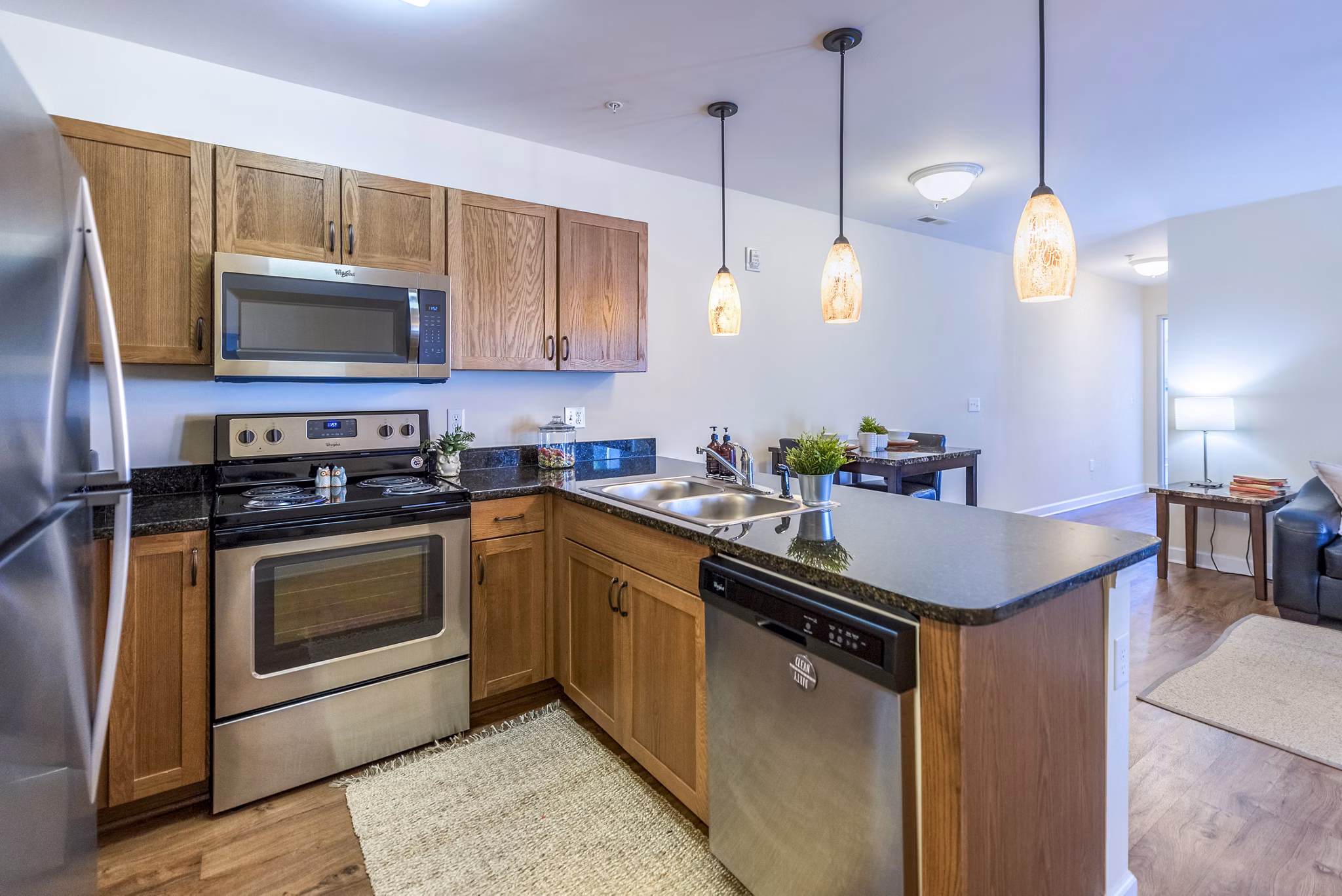 Modern kitchen with stainless steel appliances at Campus View Apartments