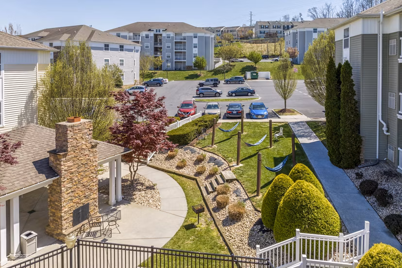 Relaxing patio with hammocks at Campus View Apartments, perfect for unwinding in a serene outdoor space