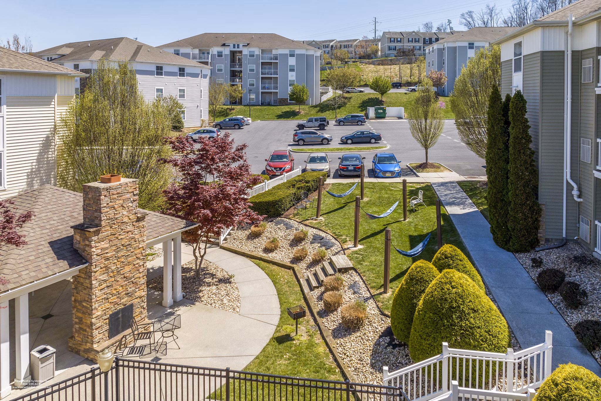 Relaxing patio with hammocks at Campus View Apartments, perfect for unwinding in a serene outdoor space
