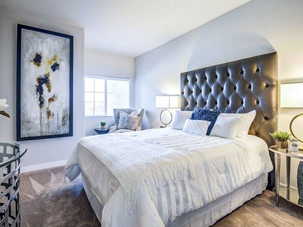 Cozy bedroom with modern decor at Sereno Apartments