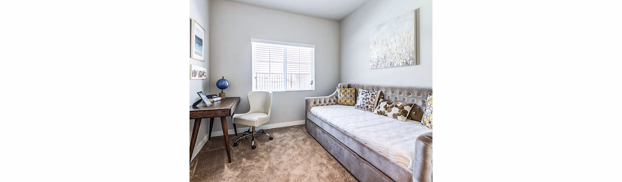 Spacious bedroom with home office space at Sereno Apartments, offering comfort and functionality for luxury living
