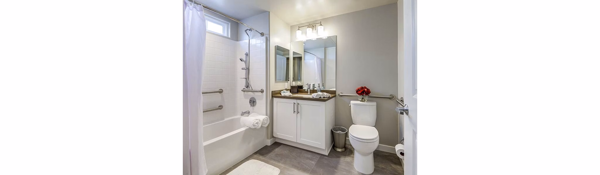 Modern bathroom with marble countertops and elegant fixtures at Sereno Apartments