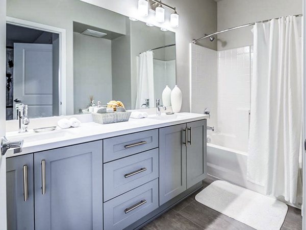 Modern bathroom with sleek fixtures at Sereno Apartments: Greystar luxury living experience
