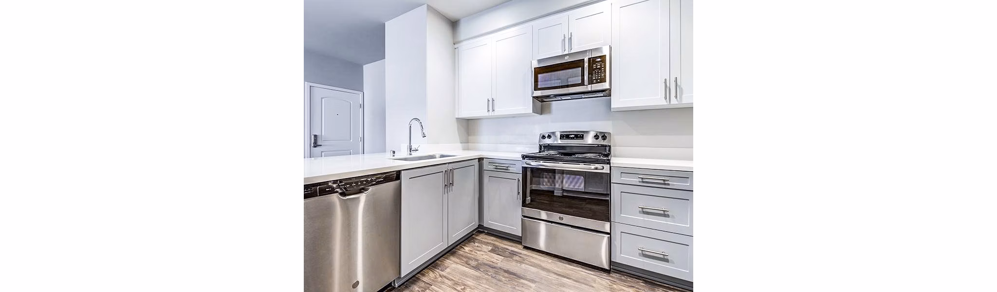 Modern kitchen with stainless steel appliances at Sereno Apartments