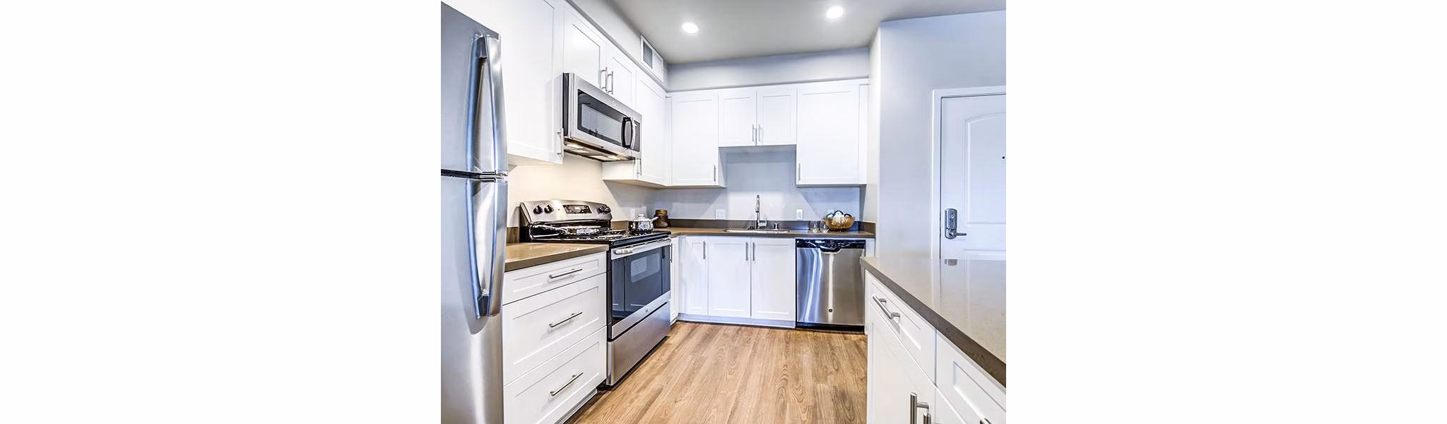 Modern kitchen with stainless steel appliances at Sereno Apartments