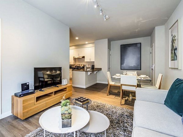 Contemporary living room with stylish decor and open layout at Sereno Apartments, offering luxury living in premium residential spaces