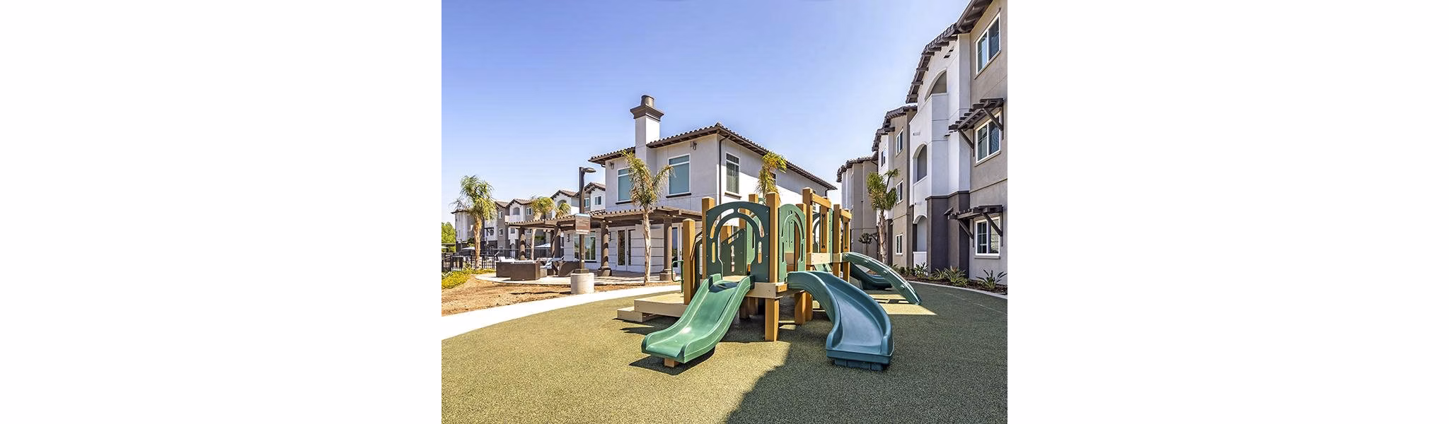 Playground with modern equipment at Sereno Apartments, providing a fun and safe outdoor space for children and families to enjoy