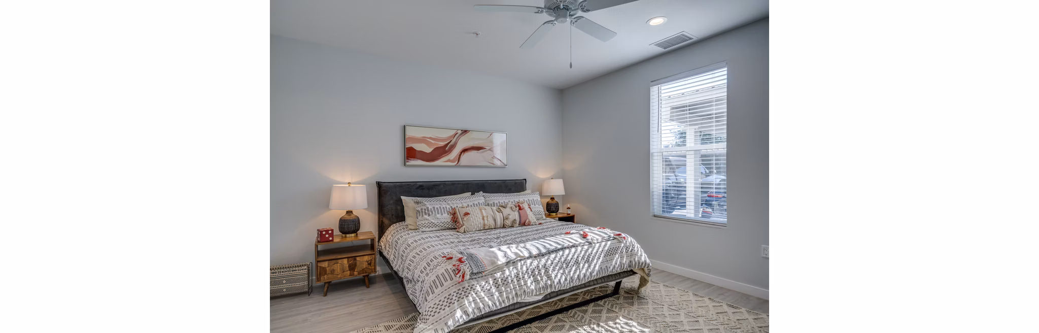 Cozy bedroom with modern decor at FLATZ 602 Apartments featuring luxury bedding, enhancing comfort and style