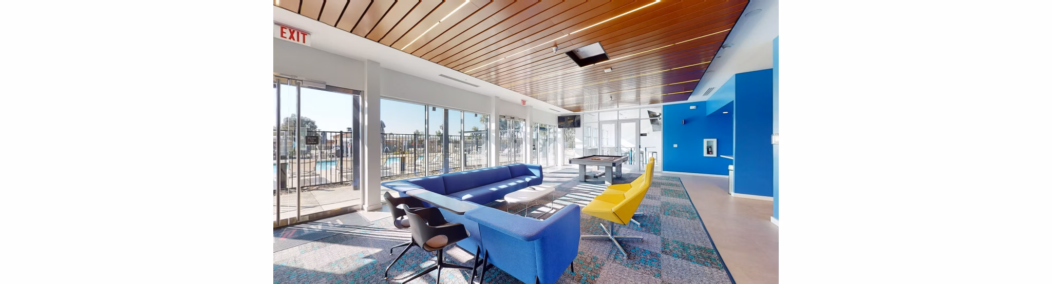 Modern clubhouse with sleek design at FLATZ 602 Apartments, perfect for gatherings and leisure activities