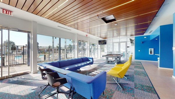 Modern clubhouse with sleek design at FLATZ 602 Apartments, perfect for gatherings and leisure activities