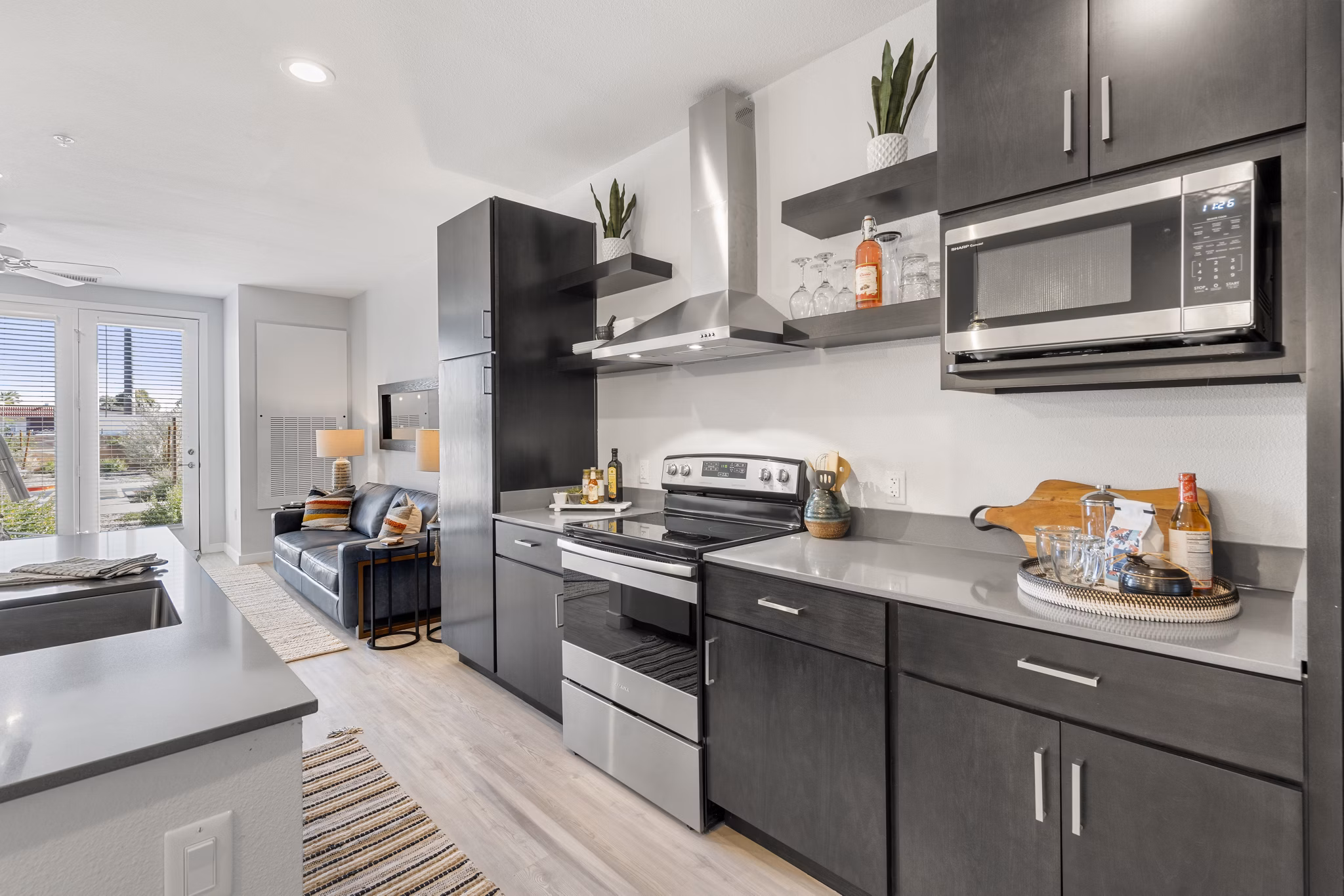 Modern kitchen with sleek cabinets and stainless steel appliances at FLATZ 602 Apartments