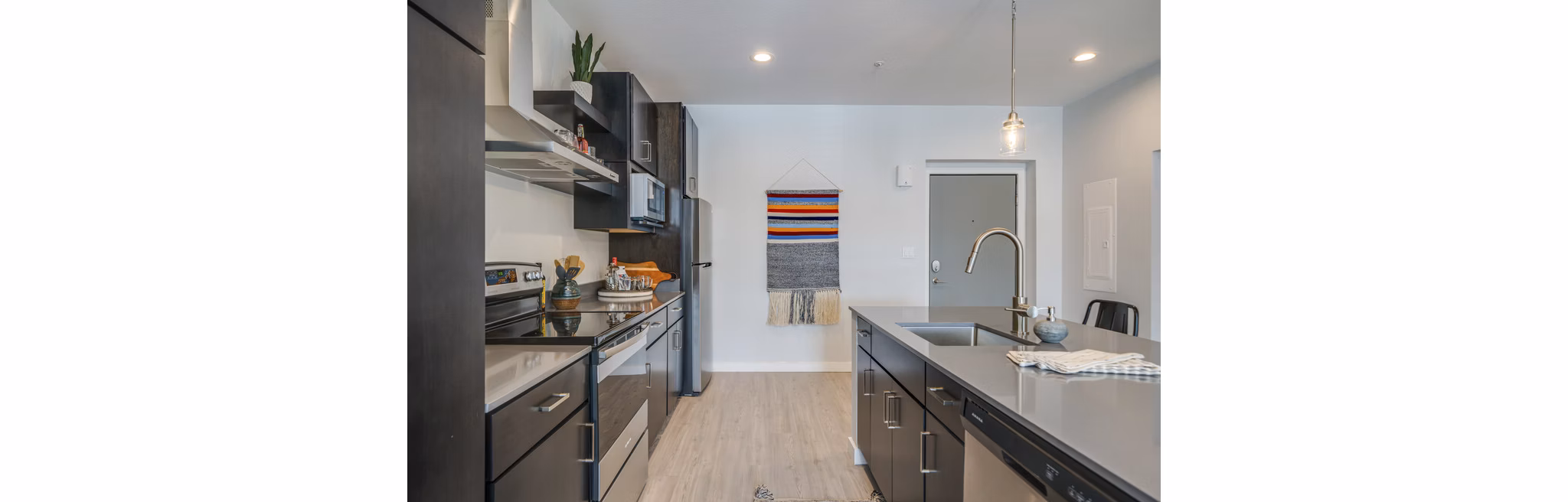 Modern kitchen featuring sleek countertops and stainless steel appliances at FLATZ 602 Apartments, a Greystar luxury property